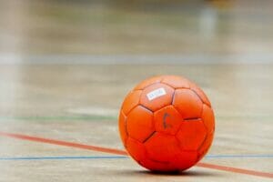 An image of a handball ball on the floor